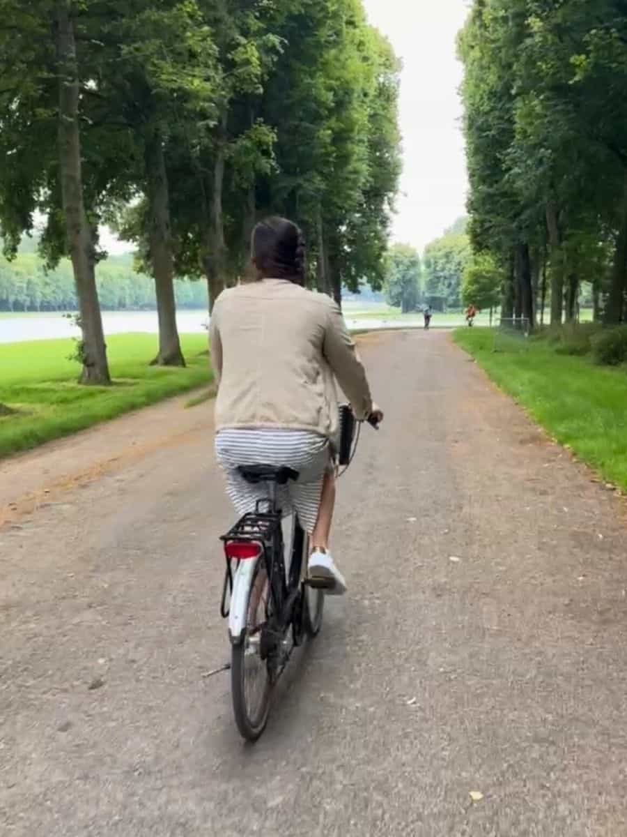 Liz riding bikes through the gardens of Versailles