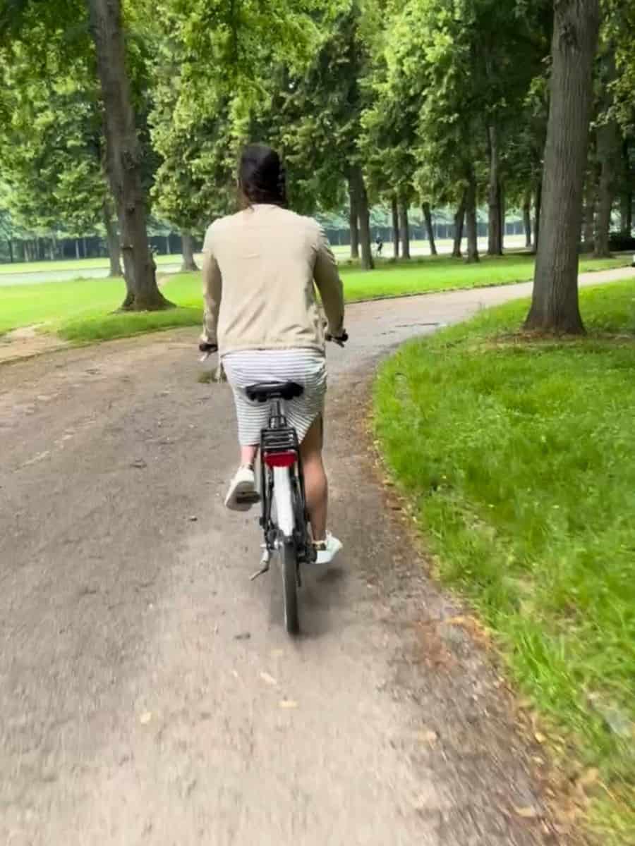 Liz riding her bike - renting bikes at Versailles was the highlight of our day on the palace grounds