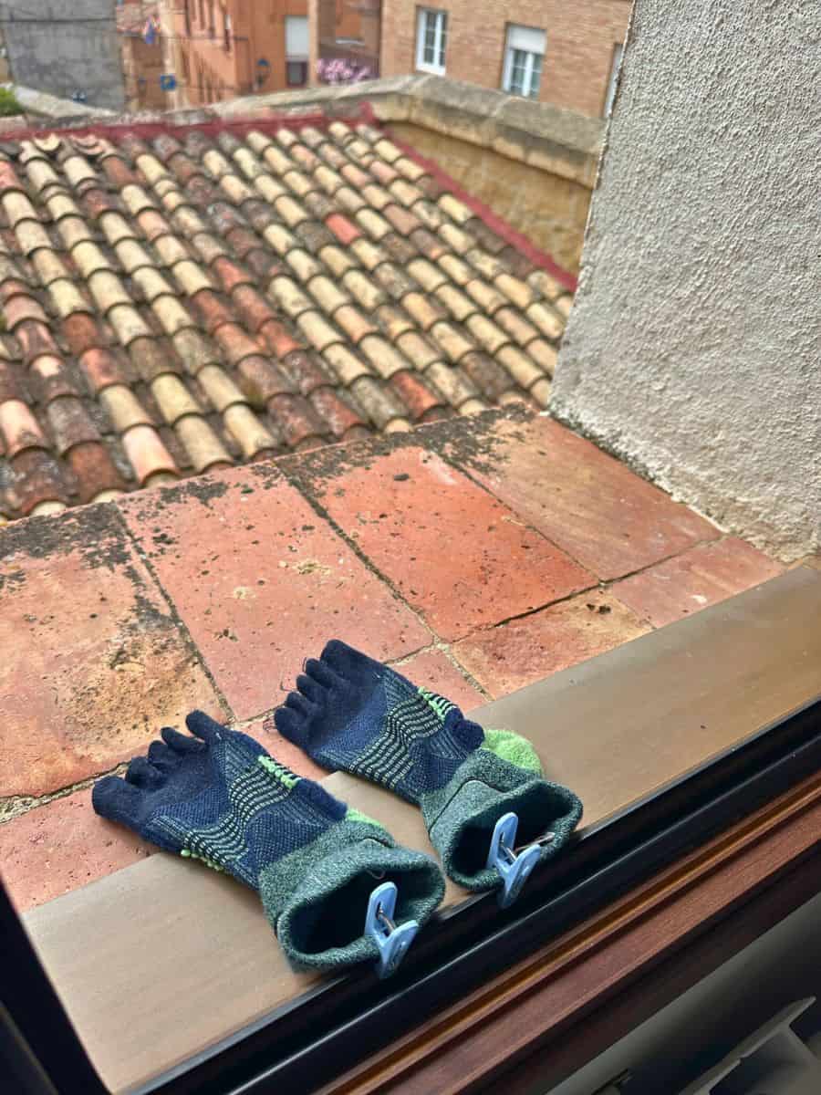 Liz's Injinji toe socks drying on our hotel room window sill 