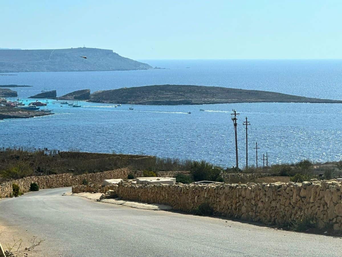A view from our rental car on Gozo Island, looking out toward Comino Island 