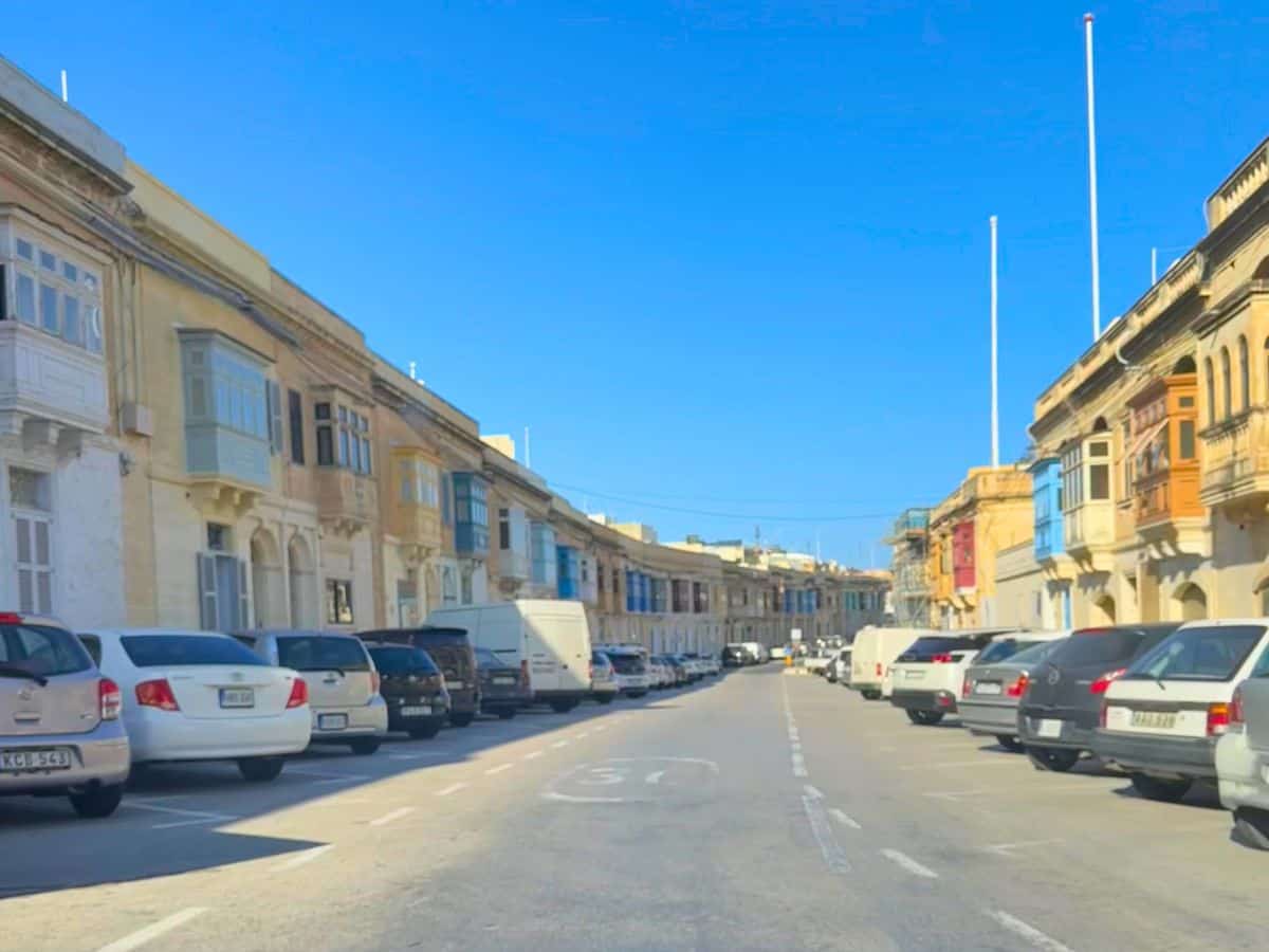 Cars lining the street in Senglea, Malta
