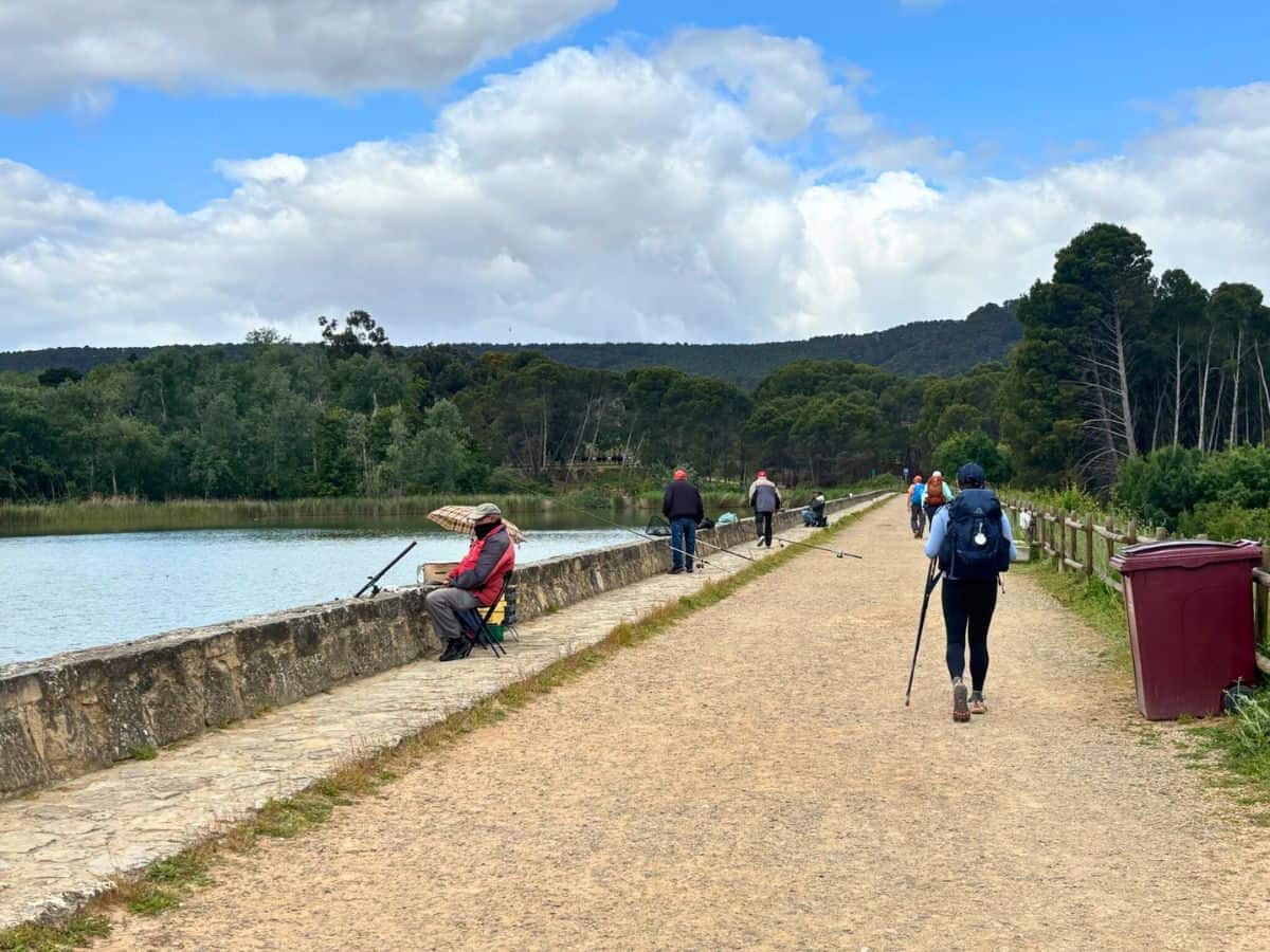 Liz walking along a reservoir outside of Lorgono along the Camino Francés. 