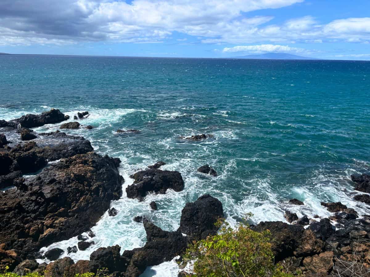 Waves crashing against rocks along the Wailea Coastal Trail walk